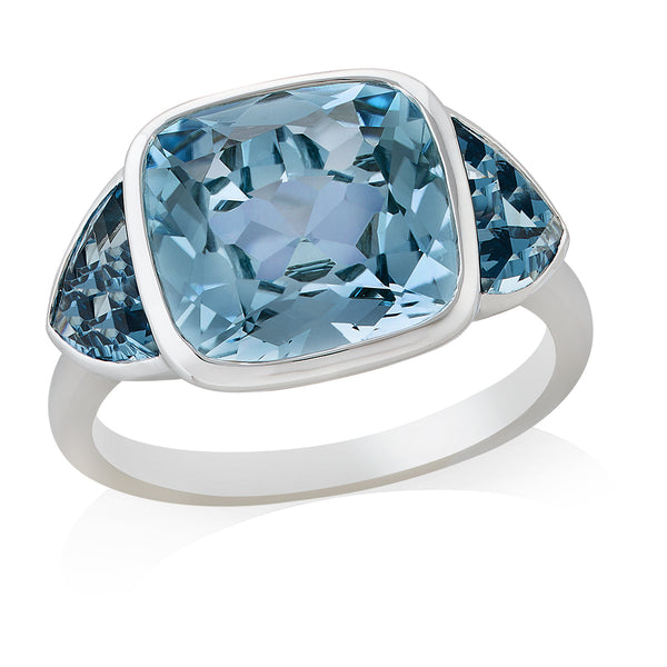 18ct White Gold Rub Set Cushion Cut Blue Topaz and Trapeze Cut London Blue Topaz Three Stone Ring