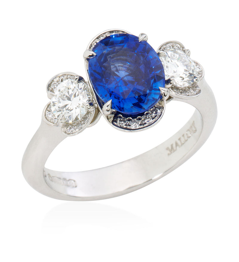 Platinum Three Stone Four Claw Set Oval Cut Sapphire and Diamond Ring